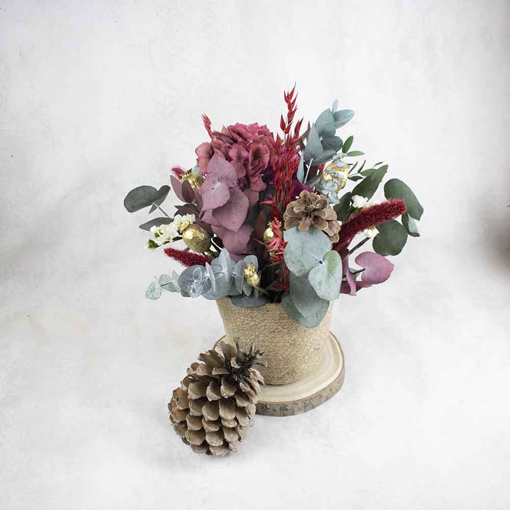 Centro navideño con flores secas Cometa